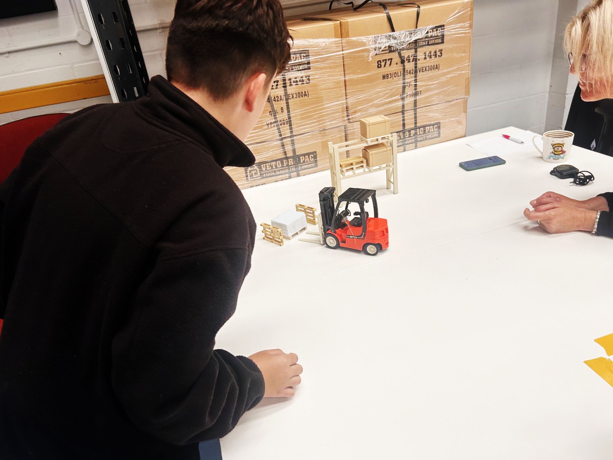 Student with RT forklift